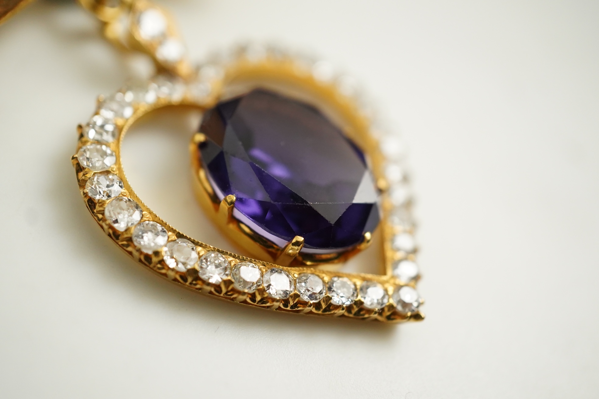 A synthetic sapphire and diamond pendant, mid 20th century